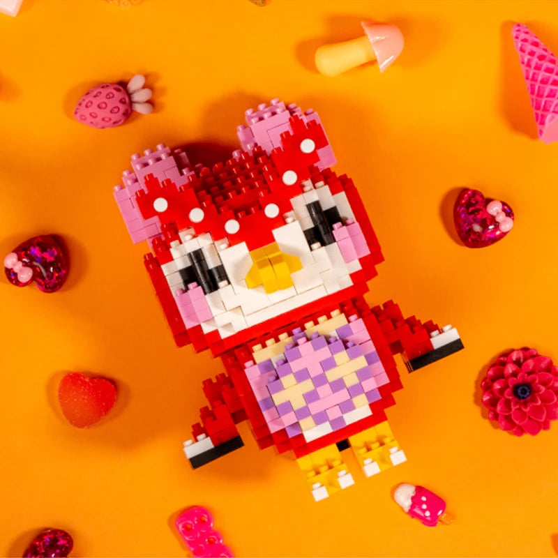 A red and pink animal-themed building block figure resembling a tiger face is displayed on an orange background.