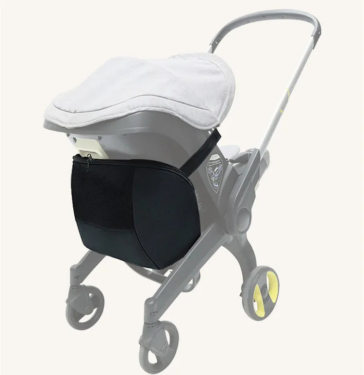 A gray stroller with a black mosquito net shade attached to the canopy and yellow wheels.