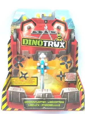 A Dinotrux dinosaur truck toy car with removable dinosaur figures displayed in its packaging.
