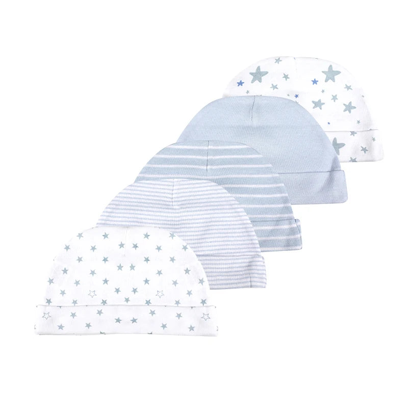 A collection of five light blue and white patterned baby knit hats for infants.