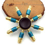 A metal fidget spinner with a rainbow finish featuring gold and blue accents.