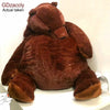 A brown bear plush cushion is shown in a close-up view.