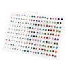 A sheet of acrylic studs featuring assorted colored hearts, stars, and moons for earrings.