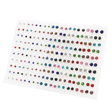 A sheet of acrylic studs featuring assorted colored hearts, stars, and moons for earrings.