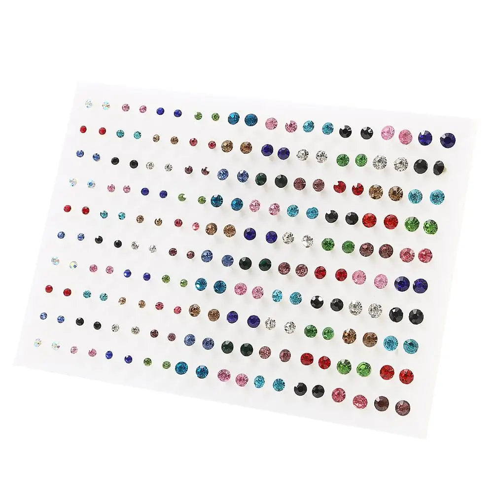 A sheet of acrylic studs featuring assorted colored hearts, stars, and moons for earrings.