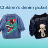 Children's denim jacket featuring a green dinosaur graphic and a plush teddy bear detail.