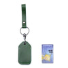 A dark green vintage cowhide leather key wallet with a metal keyring and a small blue card holder.