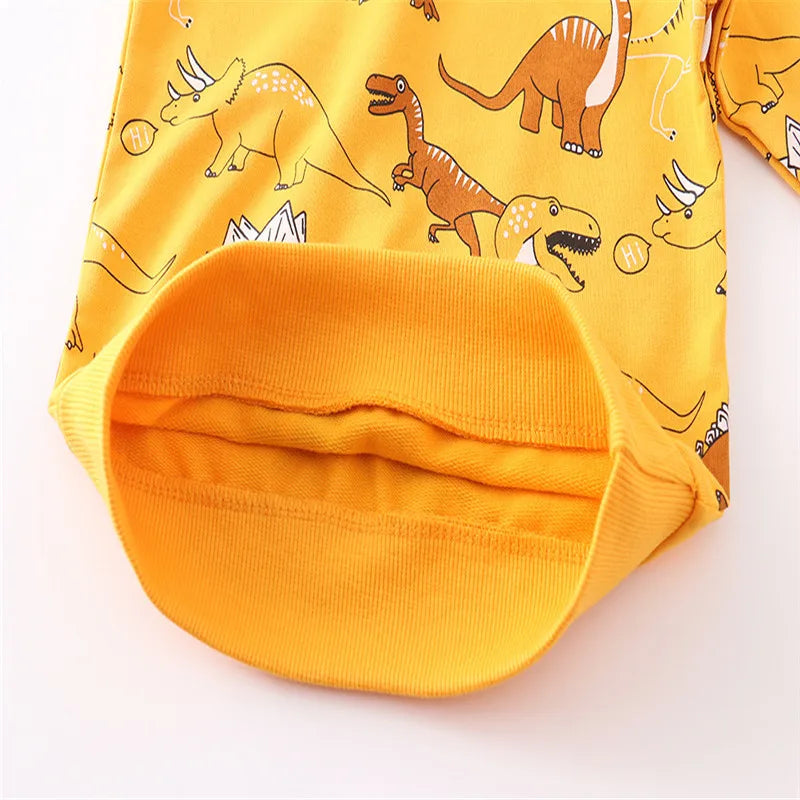 A yellow kids dinosaur print pullover sweatshirt shown flat lay.
