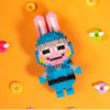 A minifigure of a pink rabbit built from blue and gray LEGO bricks against an orange background.