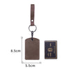 A brown leather key wallet with a card holder and a matching leather strap.