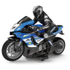 A black and blue 1:10 scale remote control stunt motorcycle with a rider figure.
