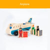 Wooden train track accessories set featuring an airplane and a gas station scene.