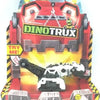 A Dinotrux dinosaur truck toy car with removable dinosaur figures displayed in its packaging.