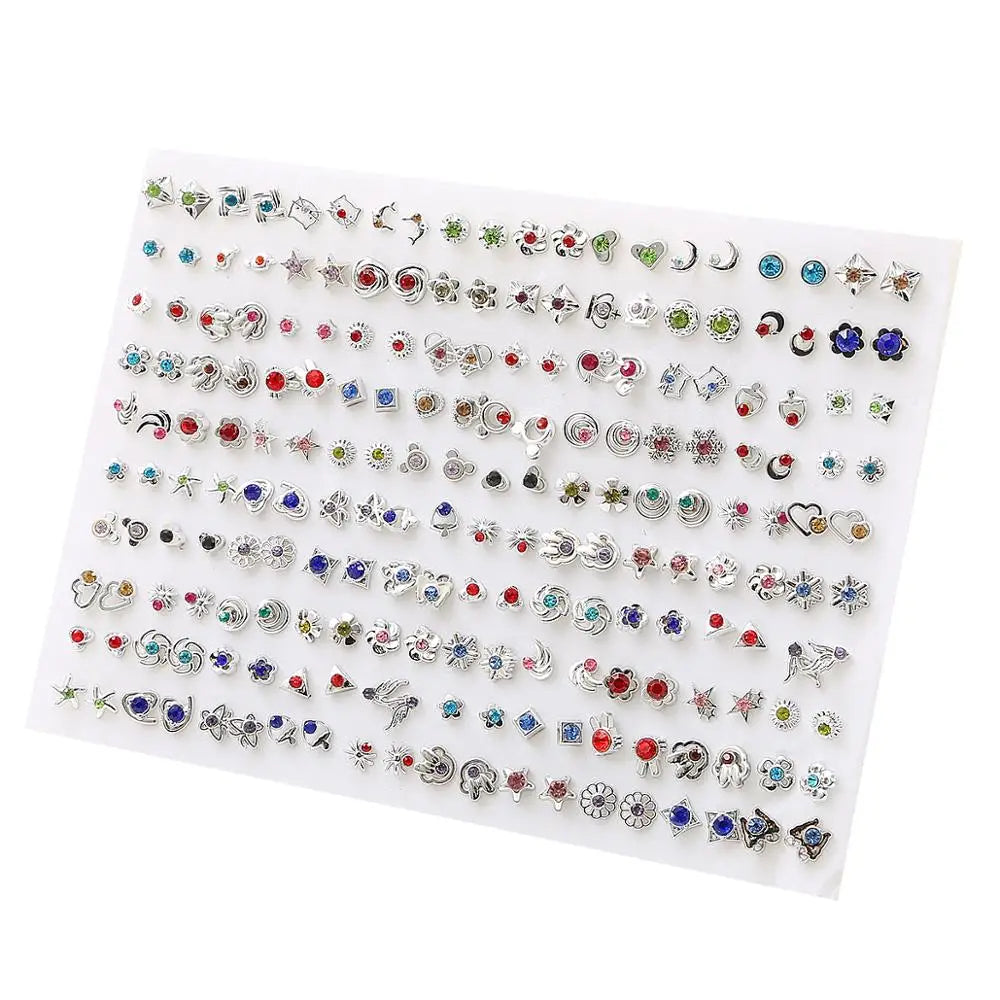 A display of assorted acrylic stud earrings featuring hearts, stars, and moons in various colors and designs.