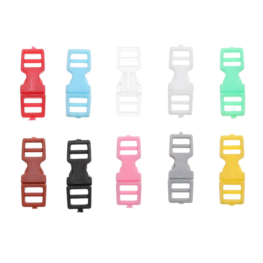 A collection of ten mini plastic buckles in various colors including red, blue, white, green, pink, black, and yellow.