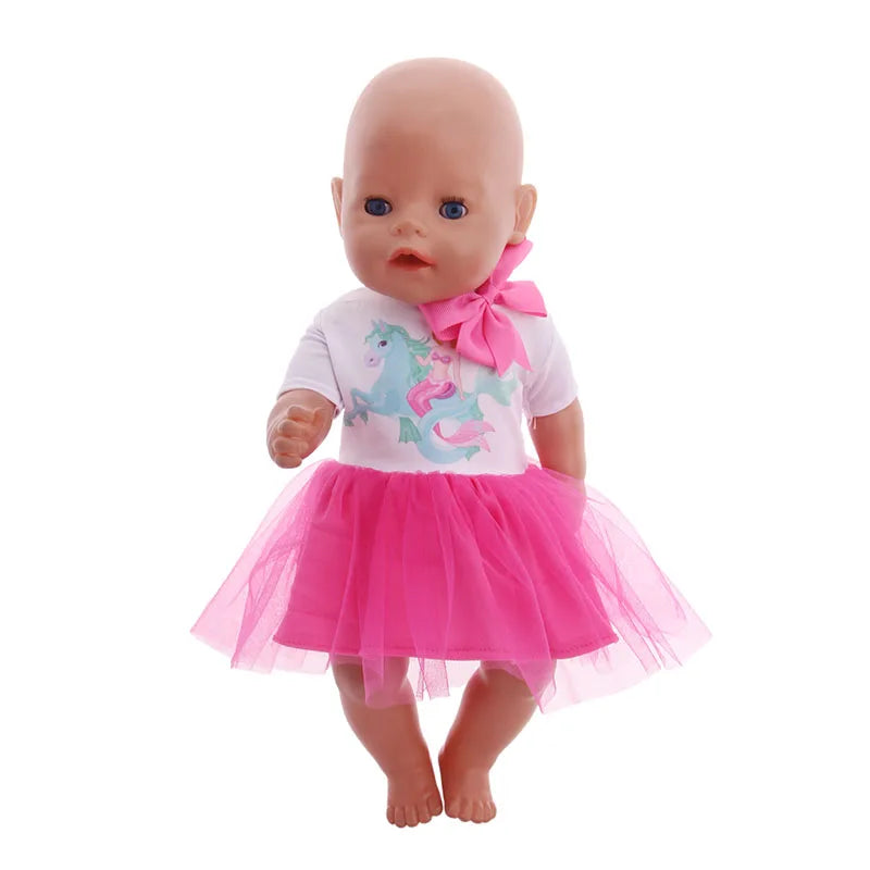 A baby doll with light skin, blue eyes, and a pink dress featuring a unicorn design.