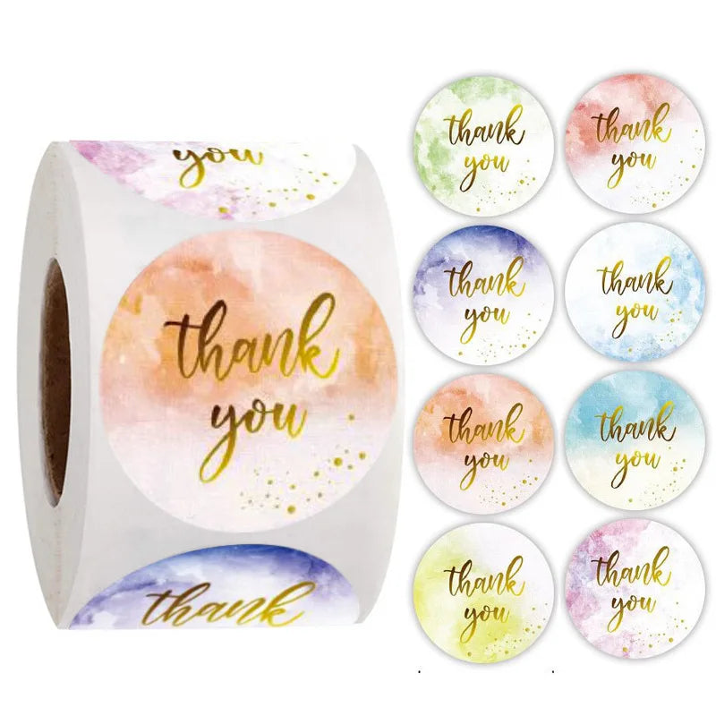 Roll of colorful round thank you stickers featuring watercolor floral designs and text