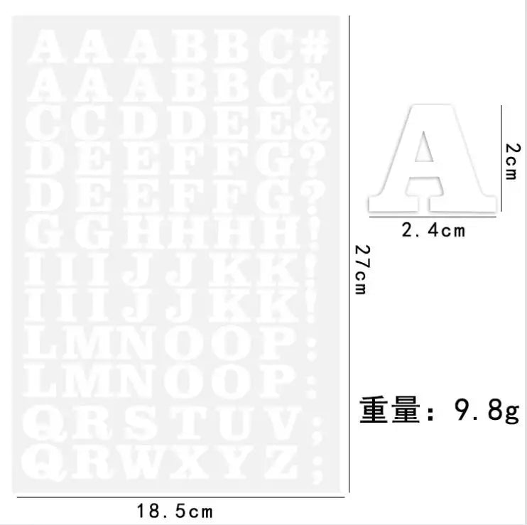 A sheet of DIY iron-on heat transfer patches showing an alphabet and number sequence for crafting