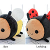 A plush toy of a bee and a ladybug side by side.
