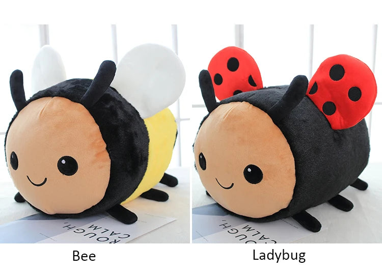 A plush toy of a bee and a ladybug side by side.