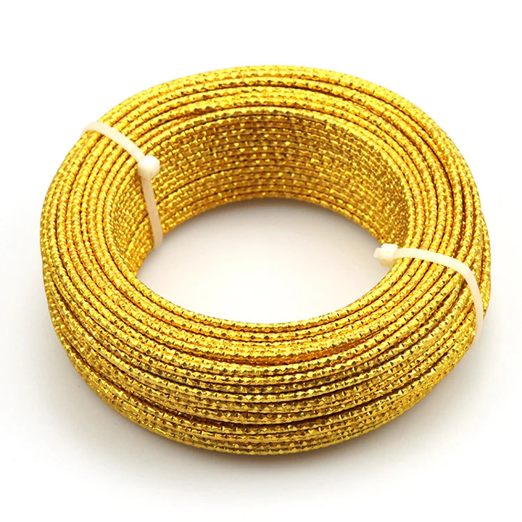 A coil of flexible gold-colored aluminum craft wire used for jewelry making and DIY projects.