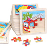 A set of wooden tangram puzzles featuring animal and traffic designs, stacked and laid out.