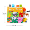 A colorful cloth book featuring farm animal tails for baby sensory development.