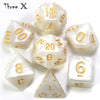 A collection of white marble effect polyhedral dice including d12, d20, d8, and d6.