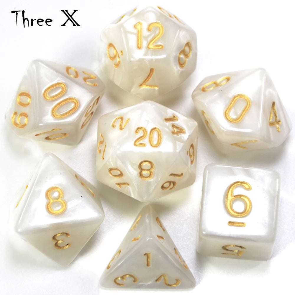 A collection of white marble effect polyhedral dice including d12, d20, d8, and d6.