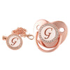 Rose gold bling baby pacifier clip featuring a silicone holder and a large letter G charm