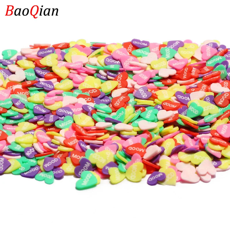 Assortment of colorful heart-shaped soft polymer clay slices for nail art and DIY crafts
