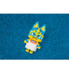 A yellow and blue building block figure resembling a fox or canine character is shown against a blue background.