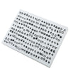 A white plastic tray filled with assorted acrylic stud earrings including hearts, stars, and moons.