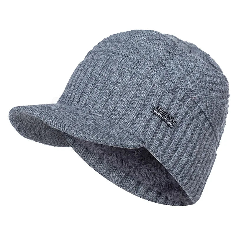 A gray knit beanie with a brim and a small jean logo on the front