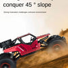 A red 4WD remote control off-road crawler truck is driving down a dirt slope, kicking up dust.