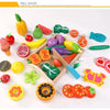 A wooden magnetic fruit and vegetable cutting play set featuring various colorful fruits and vegetables.