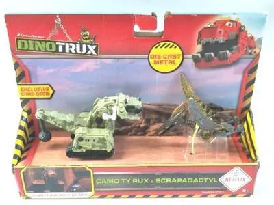 A box of Dinotrux dinosaur truck toy cars and removable dinosaur figures.