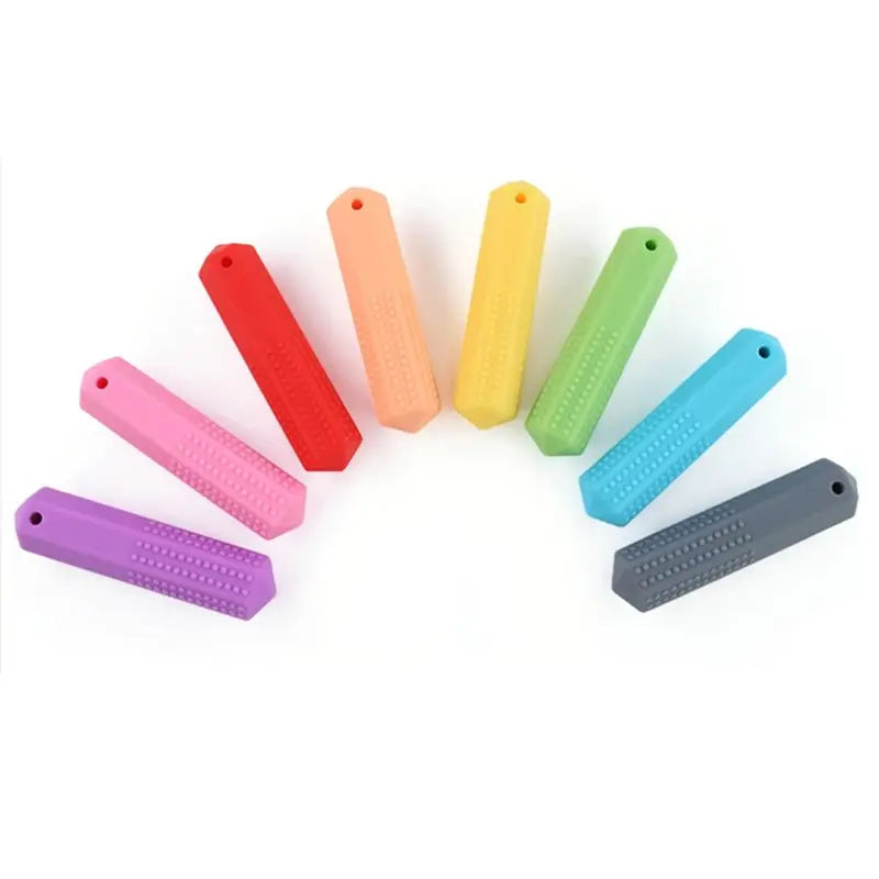 A collection of colorful silicone chew necklaces in various shades including red, orange, yellow, green, blue, and purple.