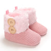 Pink plush baby snow boots for girls and boys with a knitted sole
