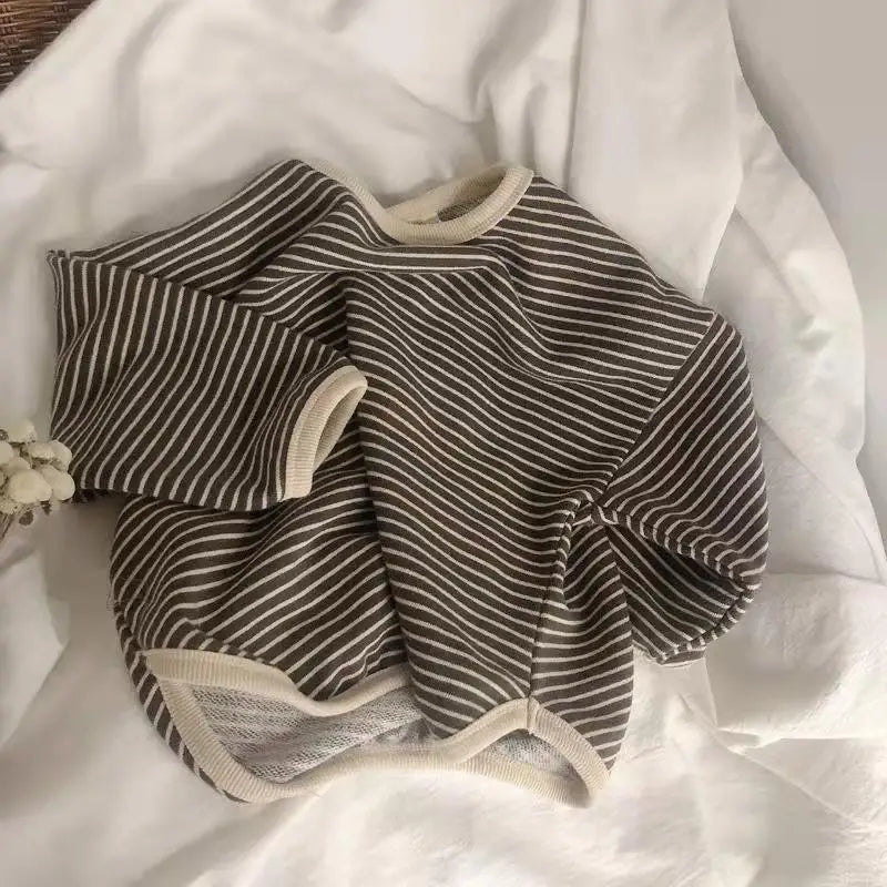 A striped gray and white kids cotton pullover sweatshirt laid flat on a white background.