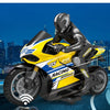 A yellow and black 1:10 scale remote control stunt motorcycle is shown in a dynamic pose against a city skyline backdrop.