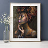 A framed painting of an African woman's portrait with intricate texture and warm tones.