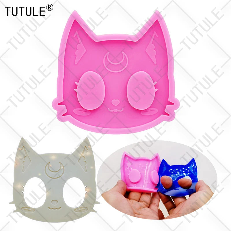 Pink silicone cat head mold for DIY keychains and craft projects shown in various forms.