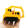 A yellow line-following robot car toy with a yellow plastic arm is held in a hand.