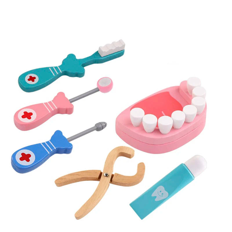 A wooden pretend play doctor medical kit for kids showing various tools like a tongue depressor and a syringe.