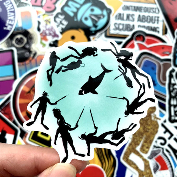 A hand holds a die-cut black silhouette sticker featuring multiple figures in dynamic poses against a light blue background.