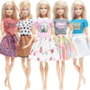 Five blonde dolls wearing casual tops and skirts in various colors and patterns