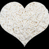 A heart shape filled with white soft polymer clay candy sprinkles for cake decorating