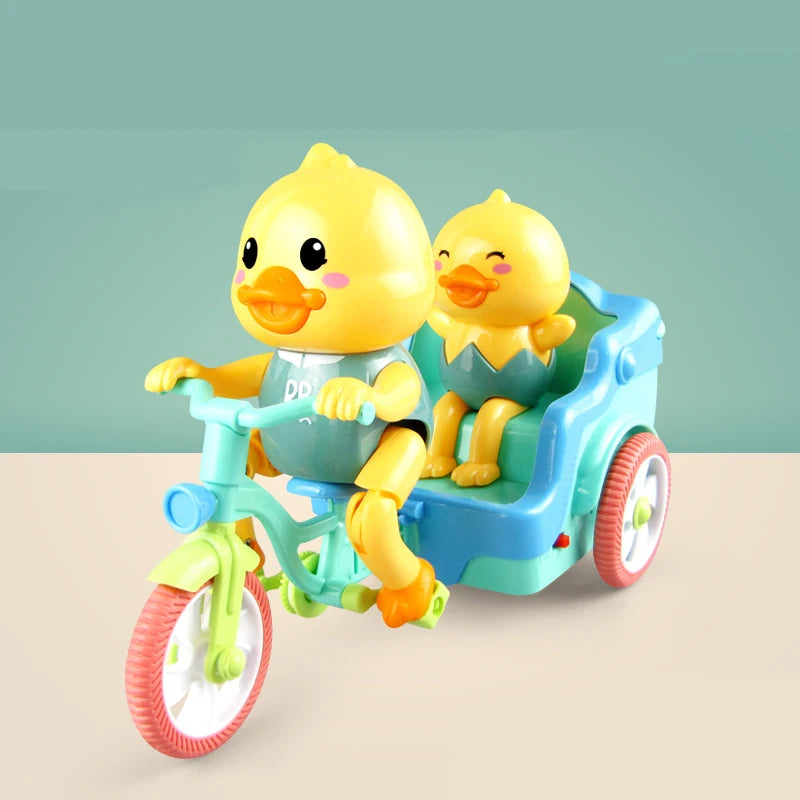 A yellow duck toy is seated in a blue electric tricycle with a green frame.
