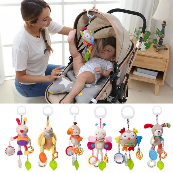 A collection of musical plush animal rattles featuring various animals like rabbits, birds, and monkeys.